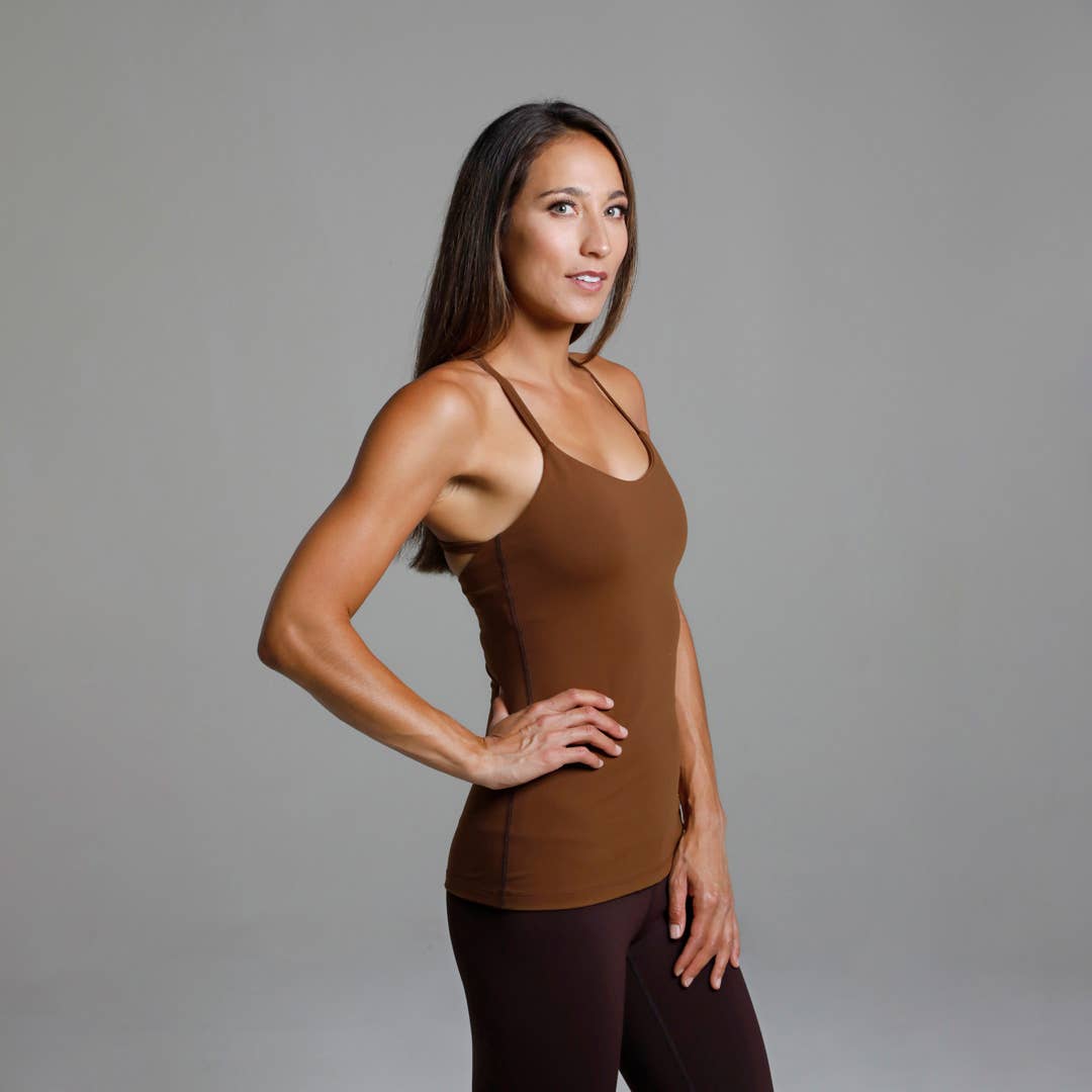 Warrior Y-Back Yoga Tank (Bronze)
Why We Love This: This Yoga Tank will be the most versatile top in your closet! The strappy back draws compliments while supporting you flawlessly! Features: KiraGrace PowerStrong: Feels like cotton and keeps you dry High-compression: Form fitting, keeps the girls supported Moderate support with build in shelf bra and pockets for removable cups Flat-lock design seams to prevent abrasion Made in U.S.A. of imported fabric Fabric and Care: POWERHOLD: Supplex/Spandex (heavy wei
