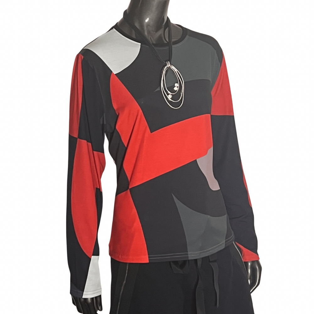 Andrea Geer Fitted Tee - Dynamic
A dynamic print digitally rendered from the designer's original artwork energizes this jersey tee—a fresh and free-spirited update to a wardrobe staple. Classic fit tee in a shaped silhouette with waist definition. Very very flattering and the print will make the room take notice. Details Classic fit (not too fit, not too loose) Shaped silhouette Solid banded neckline Long sleeves Hip length Model is 5'10'' and wearing size XS Artist-made in the U.S.A. Fabric & Care 95% poly