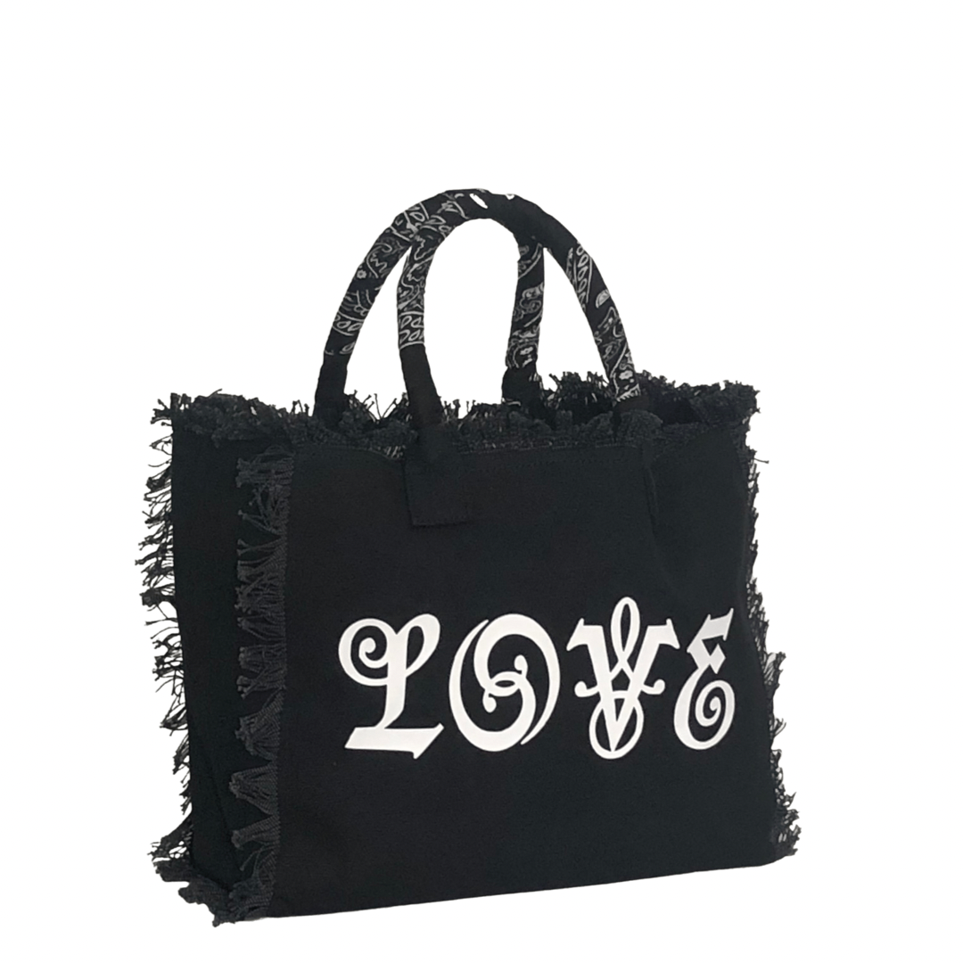 LOVE Shoulder Tote - Bandana - Black/White
We have improved this best-selling bag! Now larger and roomier it's a shoulder tote and fully lined too! Fringe Bag Perfect everyday bag! - "LOVE" Fully lined canvas tote with soft-support bottom and bandana covered handles. Inside bag has 1 convenient inside zippered pockets and 2 insert pockets. Bag handles are at 7.5" drop and fits comfortably around the shoulder. Dimensions: 12"X14"X6.5" Made in USA
LOVE Shoulder Tote - Bandana - Black/White
"LOVE" Fully lined