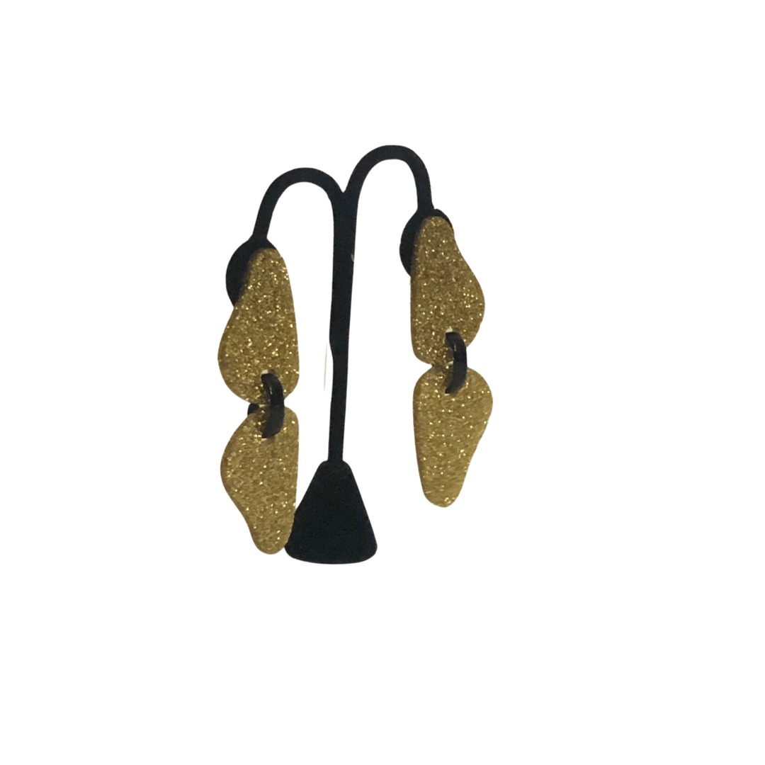 Twins All Gold Earrings
Bold and beautiful, the Michaela Malin Twin Leaves Earrings are simple yet stunning. Material: Acrylic and sterling silverOrigin: Made in Israel Lightweight Textured leaves print Clip on and piercing 3.5" long
Twins All Gold Earrings
Our Viso Black earrings by Michaela Malin are a show stopper for sure. They are light and airy and so much fun to wear. Bold and beautiful 
twingold

$95
$95
$95
acrylic earrings, earrings, gold and black earrings, gold and black sparkle earrings, gold c