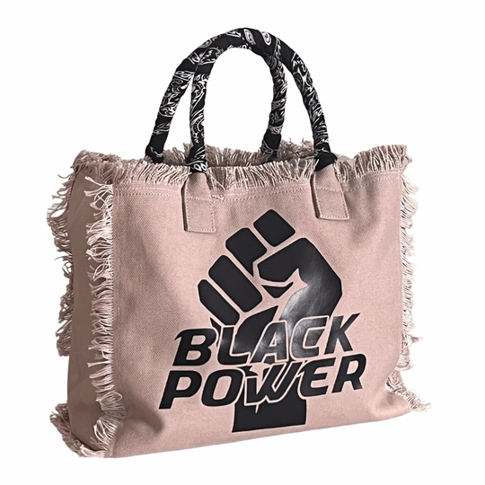 Black Power Shoulder Tote - Bandana - Beige
We have improved this best-selling bag! Now larger and roomier it's a shoulder tote and fully lined too! Fringe Bag Perfect everyday bag! - "Black Power" Fully lined canvas tote with soft-support bottom and bandana covered handles. Inside bag has 1 convenient inside zippered pockets and 2 insert pockets. Bag handles are at 7.5" drop and fits comfortably around the shoulder. Dimensions: 12"X14"X6.5" Made in USA
Black Power Shoulder Tote - Bandana - Beige
Gym Brat,
