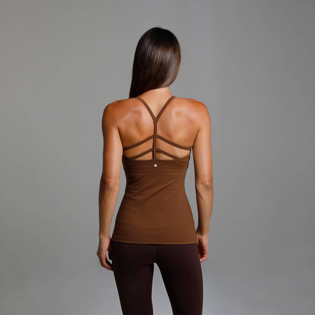 Warrior Y-Back Yoga Tank (Bronze)
Why We Love This: This Yoga Tank will be the most versatile top in your closet! The strappy back draws compliments while supporting you flawlessly! Features: KiraGrace PowerStrong: Feels like cotton and keeps you dry High-compression: Form fitting, keeps the girls supported Moderate support with build in shelf bra and pockets for removable cups Flat-lock design seams to prevent abrasion Made in U.S.A. of imported fabric Fabric and Care: POWERHOLD: Supplex/Spandex (heavy wei