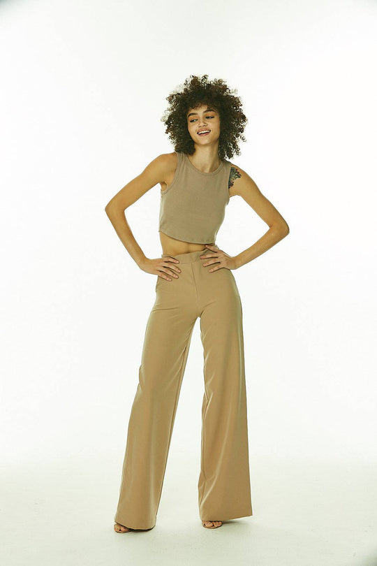 Nude Wide Leg Side Zip Pants with Faux Pockets
This is your go-to for all the latest trends, no matter who you are, where you're from and what you're up to. They have side front pockets, faux welt back pockets and invisible side zipper. Edit these pants to match your style. Created by us, styled by you. Fabric has a little bit of stretch and hugs the body in all the right places. Looks great with over blouses or tanks and jackets. Model height: 5"11 Waist Size Large: 31" Inseam: 36 Pants made extra for tall