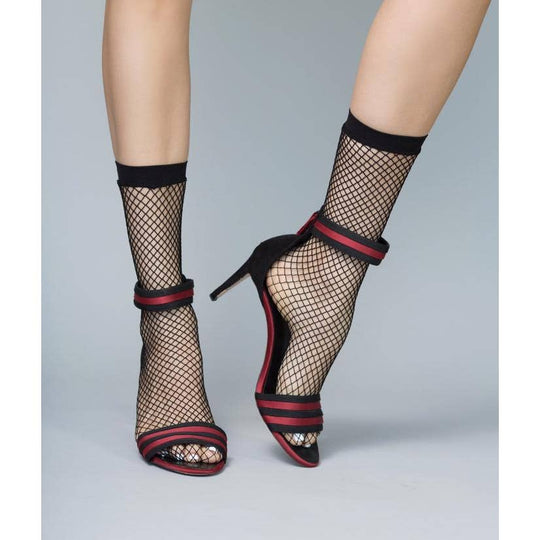 Catch 'Em Fishnet Socks - Diamond Pattern
Our black high heel jungle fishnet socks are knitted in a diamond-shaped pattern and feature a wide elasticated ankle band. This band will prevent them from slipping and these socks can be styled a variety of ways. Black stretch nylon and spandex. One size comfortably fits a US size 5-9 / EU size 35-40. Hand-wash only.
Catch 'Em Fishnet Socks - Diamond Pattern
Our black high heel jungle fishnet socks are knitted in a diamond-shaped pattern and feature a wide elastic