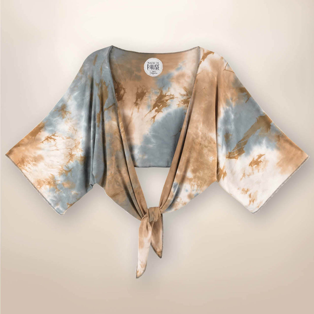 Harper Bolero Tie Dye Jacket
Hand Tie-Dyed Bolero Jacket Feel Zenful in our relaxed, loose fitting, rayon spandex, Hand Tie-Dyed Bolero Jacket with Tie. Each garment is adorned with an unique, inspirational sentiment. Our exclusive fabric is made from the softest Rayon/Spandex material. Our Bolero with Tie can be worn open or closed, tied in a lovely, flattering knot or worn with the ties accentuating the sides of the garment. Tying the ties when worn open and draped allows for another complimentary look. C