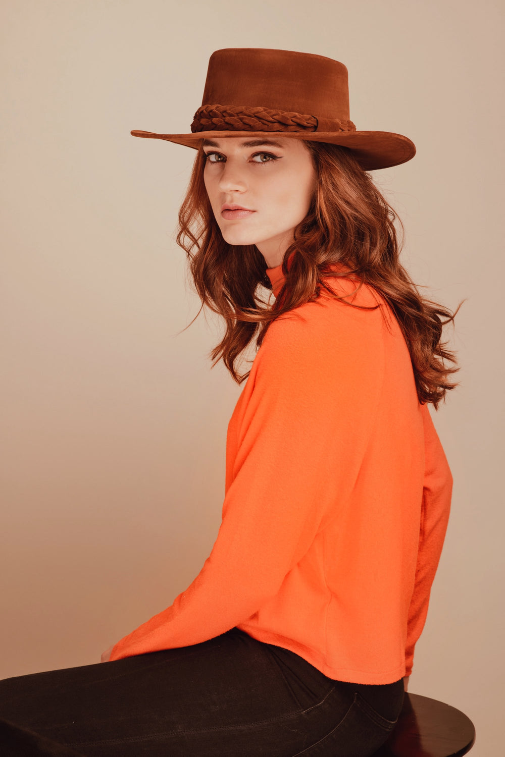 Brown Eyed Girl Faux Suede Hat
Brown Eyed Girl Faux Suede Hat The Brown Eyed Girl hat was inspired by the famous Van Morrison song, as well as the light-hearted and curiosity-seeking spirit of travel. The sculpted crown and brim are swathed in rich cognac felt and complemented by a statement braid. It draws design influence from the classic Spanish cordobes hat. Our tan velour is made of faux suede fabric. Large - 24 in, Medium - 22 in Crown 4” Brim 3” Cordobes crown Double braided trim Inner elastic Spot/c