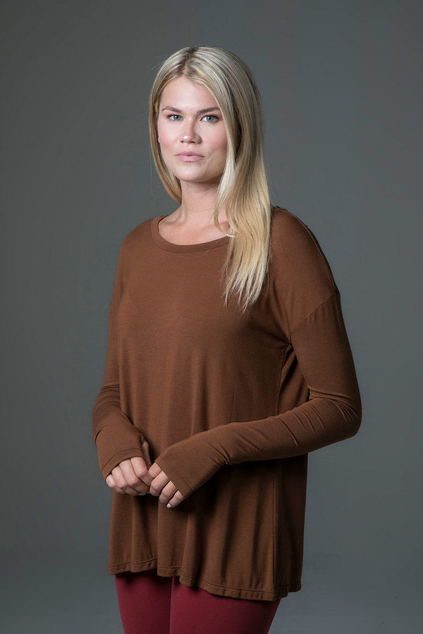 Perfect Long Sleeve Yoga Tee (Bronze)
Why we love this: This deliciously soft Yoga Tee is a fall essential in our Bronze hue, featuring a scoop neckline & thumbhole detailing on each sleeve. Featuring: KiraGrace Luxe: Feels ultra-soft and luxurious Loose & flowy Versatile, from street to studio Thumbhole detailing Made in U.S.A. of imported fabric Fabric & Care KiraGrace Luxe: Tencel® Modal/Spandex *Tencel® Modal Stretch Jersey is an ultra-luxurious, super-soft fabric derived from renewable wood sources gro