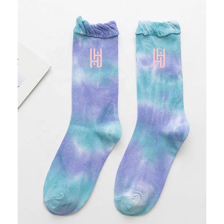 Tie Dye Sock & Scrunchie Set - Aqua Purple
Tie Dye Ruffle Sock with Matching Tie Dye Scrunchie Set The tie dye phenomenon lives on! These socks are crafted to perfection in this tie dye soft stretch cotton socks with a ruffle trim. and Each pair comes with matching large tie dye velvet scrunchie and personalized packaging. Hand-dyed design. Each pair is unique due to the dyeing process and come in a longer length for multiple styling options. Wear them with your favorite sneakers, sandals and heels. With or