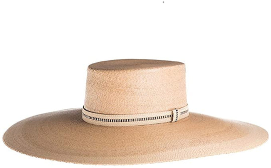 Rosalia Flat Top Palm Leaf Straw Hat
Our ultra wide palma Rosalia hat is elegant and flawlessly finished with an embroidered trim. Its body is braided by artisan hands and interlaced with palm leaves to create the finished design. 100% Palm leaf, natural color Medium 58 cm Crown 4” Brim 14 cm Flat top crown Embroidered trim Inner elastic Spot/special cleaning
Rosalia Flat Top Palm Leaf Straw Hat
The Rosalia palma hat is elegant and flawlessly finished with an embroidered trim. Braided body by artisan hands