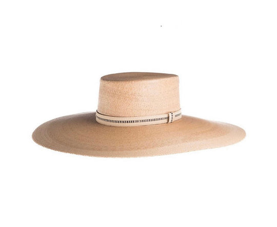 Rosalia Flat Top Palm Leaf Straw Hat
Our ultra wide palma Rosalia hat is elegant and flawlessly finished with an embroidered trim. Its body is braided by artisan hands and interlaced with palm leaves to create the finished design. 100% Palm leaf, natural color Medium 58 cm Crown 4” Brim 14 cm Flat top crown Embroidered trim Inner elastic Spot/special cleaning
Rosalia Flat Top Palm Leaf Straw Hat
The Rosalia palma hat is elegant and flawlessly finished with an embroidered trim. Braided body by artisan hands