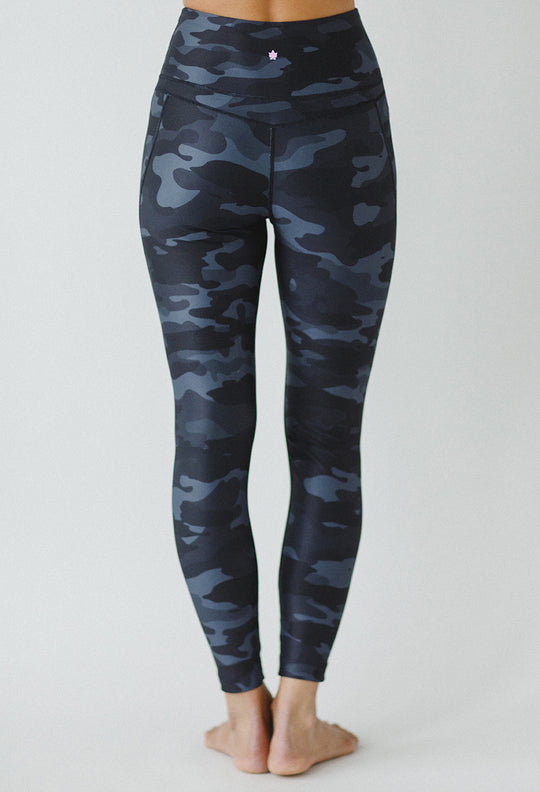 Slashed 7/8 Yoga Legging (Silver Camo)
Slashed 7/8 Yoga Leggings in Silver Camo for edgy style with a comfortable fit. These cut out yoga leggings from the Kathryn Budig Collection have an ultra high rise for flattering support and a gorgeous silver camo print. They are also the perfect pair of yoga leggings for our shorter humans, with a 25" inseam. Features: Shorter ankle length with a 25" inseam Laser cut slashes High-waisted rise with comfortable compression throughout Anti-chafe flat-lock seaming Moist