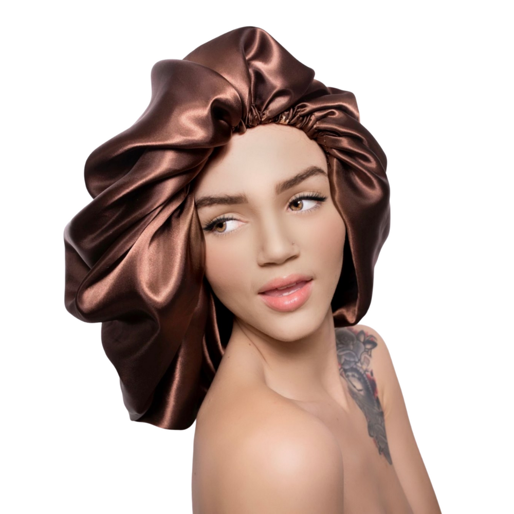 Diva Satin Hair Bonnet - XL Size
Satin hair bonnets are a staple for protecting your hair at night. The benefits of satin is that it helps reduce friction which can cause hair damage. Additionally if you have added any products to your hair before going to bed the satin bonnet will protect your pillow covering. These bonnets are bonus filled, they protect your hair, your linens and on top of all this these beautiful bonnets are beautiful to wear. Details: Bonnets are bungee cord adjustable All bonnets are l