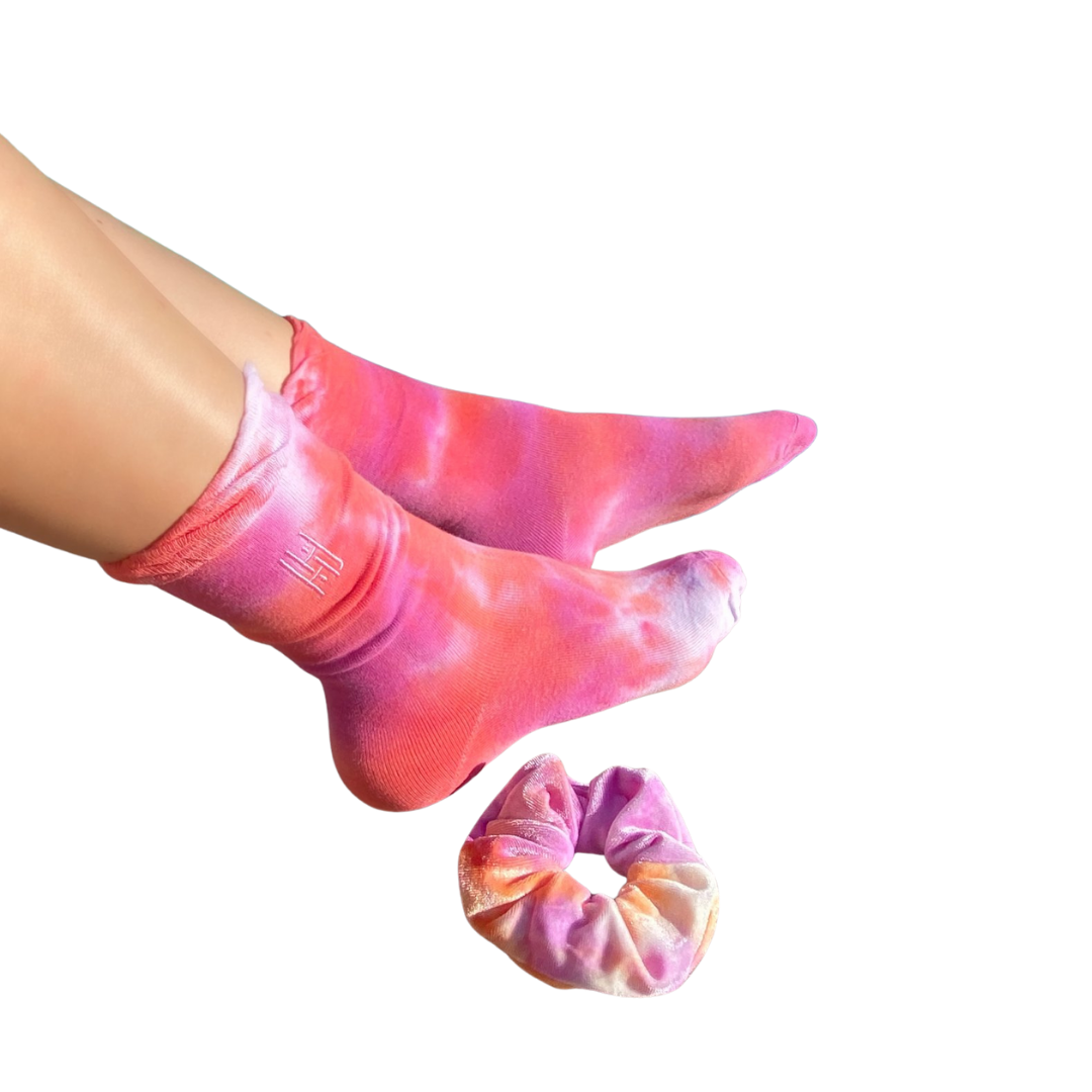 Tie Dye Sock & Scrunchie Set - Pink Tangerine
Tie Dye Ruffle Sock with Matching Tie Dye Scrunchie Set The tie dye phenomenon lives on! These socks are crafted to perfection in this tie dye soft stretch cotton socks with a ruffle trim. and Each pair comes with matching large tie dye velvet scrunchie and personalized packaging. Hand-dyed design. Each pair is unique due to the dyeing process and come in a longer length for multiple styling options. Wear them with your favorite sneakers, sandals and heels. With
