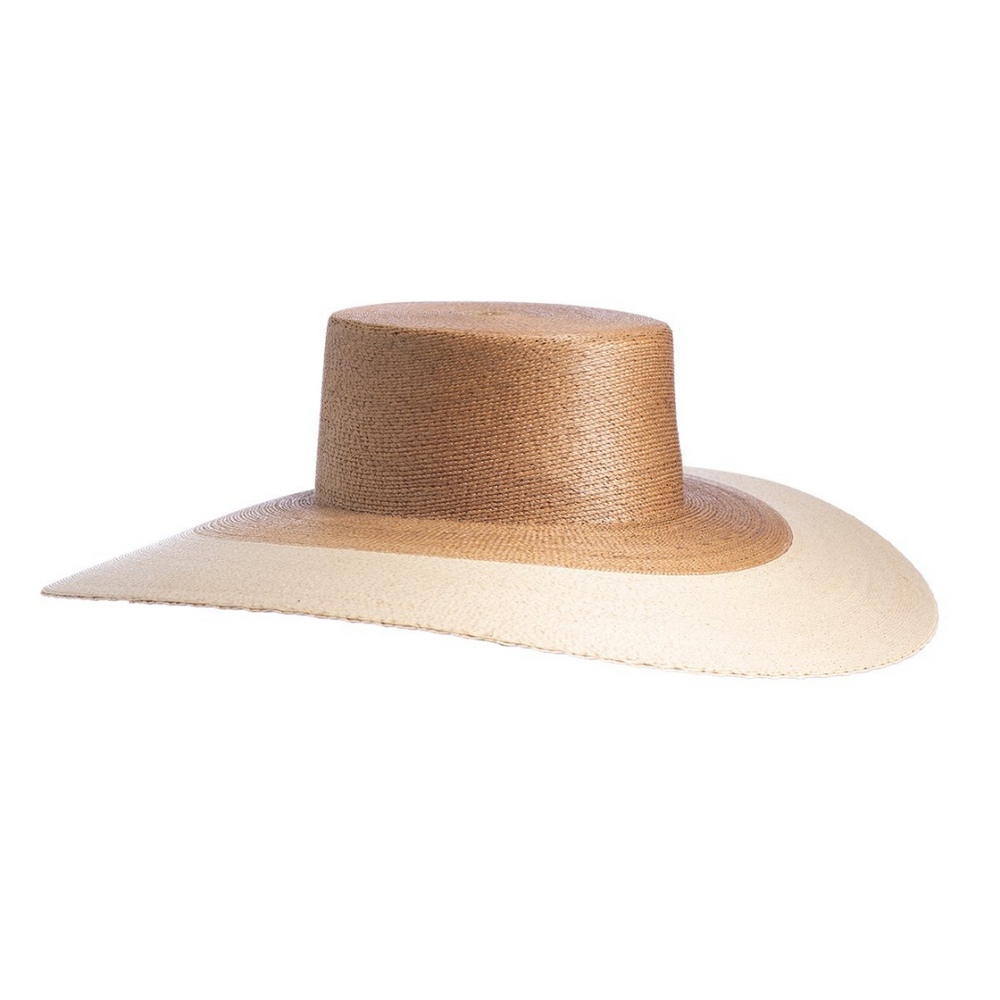 Mallorca
Our ultra wide palma Mallorca hat is elegant and flawlessly finished with a light tone brim. Its body is braided by artisan hands and interlaced with palm leaves to create the finished design. 100% Palm leaf, natural color (One Size) Standard Medium 58 cm Crown 4” Brim 5.51" Flat top crown Inner elastic Spot/special cleaning FIT SCALE True to size
Mallorca
Our ultra wide palma Mallorca hat is elegant and flawlessly finished with a light tone brim. Its body is braided by artisan hands & interlaced w