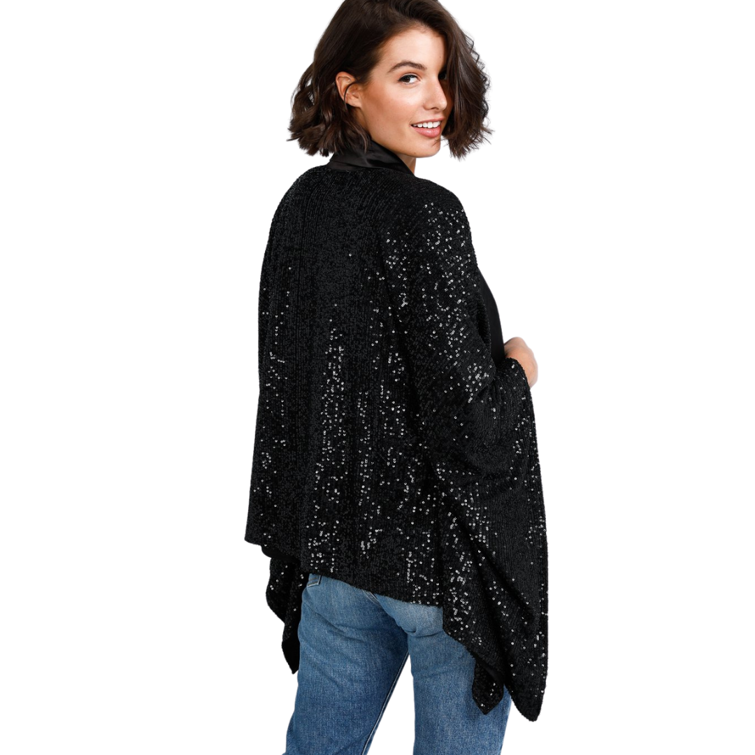 Jagger Kimono - Black Sequin Sparkles
Destined to dazzle, the Jagger Kimono composes a striking silhouette with gorgeous drape. Drenched in decadent all-over sequin embellishments, this style is perfect for party season! Part of the the Brave+True Everywoman Collection • Satin neckband• Fully lined• One size garment• Fabulous sequin fabricMeasurements:Bust = OS: 58"Length = OS:23" Model is 5'6" tallFabrication:Main: 100% polyesterLining: 100% polyester
Jagger Kimono - Black Sequin Sparkles
Destined to dazzl