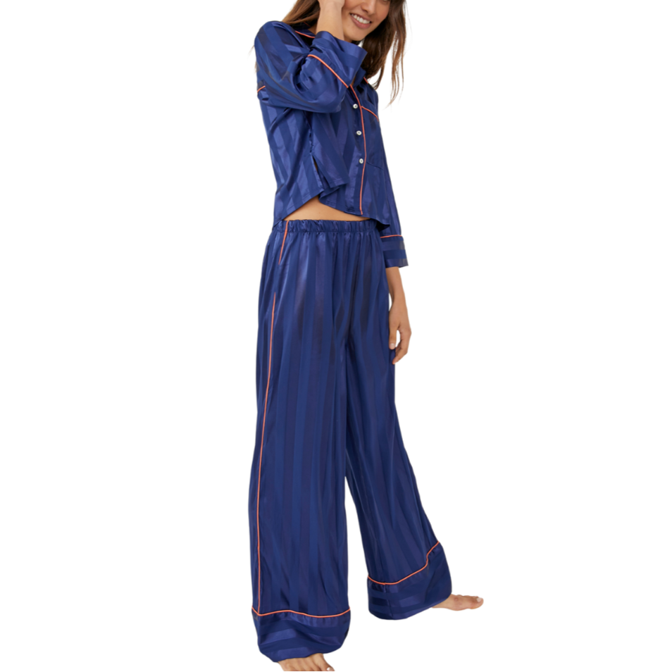 Pajama Party Sleep Set - Navy Peony
Pajamas you can get away with wearing outside of the house, this so stunning set features a matching collared shirt and wide-leg bottoms in a feminine floral print design. Top: Button-up front Cropped sleeves Chest-pocket Cropped silhouette Bottoms: Pull-on style Elastic waistband Relaxed fit legs Lightweight style Intimately Our softest intimates and best-ever base layers. Intimately is an in-house label. Care/Import Machine Wash Cold Import Contents: 97% Polyester, 3% S