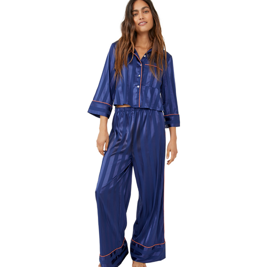 Pajama Party Sleep Set - Navy Peony
Pajamas you can get away with wearing outside of the house, this so stunning set features a matching collared shirt and wide-leg bottoms in a feminine floral print design. Top: Button-up front Cropped sleeves Chest-pocket Cropped silhouette Bottoms: Pull-on style Elastic waistband Relaxed fit legs Lightweight style Intimately Our softest intimates and best-ever base layers. Intimately is an in-house label. Care/Import Machine Wash Cold Import Contents: 97% Polyester, 3% S