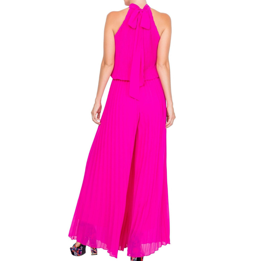 Wild Orchid Pleat Jumpsuit - Magenta
This goddess style jumpsuit features all-over vertical pleats and a sexy halter neck with an adjustable scarf tie. The true waist has an elastic gathering to fit a range of sizes. The fabric is a sheer chiffon with a gorgeous magenta hue. This jumpsuit is fully lined. This jumpsuit is so comfortable and flowy against your skin, you will feel like you are wearing your pajamas! DetailsBrand: Meghan LAColor: MagentaLength: Approx. 60" LengthQuality: 100% PolyesterSource: De
