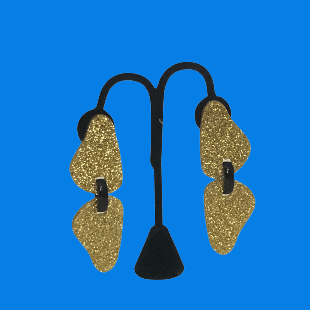 Twins All Gold Earrings
Bold and beautiful, the Michaela Malin Twin Leaves Earrings are simple yet stunning. Material: Acrylic and sterling silverOrigin: Made in Israel Lightweight Textured leaves print Clip on and piercing 3.5" long
Twins All Gold Earrings
Our Viso Black earrings by Michaela Malin are a show stopper for sure. They are light and airy and so much fun to wear. Bold and beautiful 
twingold

$95
$95
$95
acrylic earrings, earrings, gold and black earrings, gold and black sparkle earrings, gold c