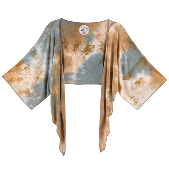 Harper Bolero Tie Dye Jacket
Hand Tie-Dyed Bolero Jacket Feel Zenful in our relaxed, loose fitting, rayon spandex, Hand Tie-Dyed Bolero Jacket with Tie. Each garment is adorned with an unique, inspirational sentiment. Our exclusive fabric is made from the softest Rayon/Spandex material. Our Bolero with Tie can be worn open or closed, tied in a lovely, flattering knot or worn with the ties accentuating the sides of the garment. Tying the ties when worn open and draped allows for another complimentary look. C
