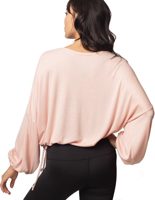 Cassidy Ribbed Knit Top - Blush
The new slouchy, oversized CASSIDY top features a beautiful boat neck, flowing gathered bell sleeves, and a drawstring tie waist. The luxuriously soft, stretchy black ribbed knit drapes gorgeously over the body. The perfect piece to pair with our leggings for an on-trend studio to street look. FABRIC 92% rayon/8% spandex4-way stretch SIZING XS/S and M/L (Model is 5'5" wearing size XS/S) CARE Wash inside out in cold water; no bleach; hang or lay flat to dry. Do not iron. Handm