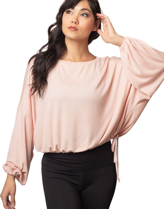 Cassidy Ribbed Knit Top - Blush
The new slouchy, oversized CASSIDY top features a beautiful boat neck, flowing gathered bell sleeves, and a drawstring tie waist. The luxuriously soft, stretchy black ribbed knit drapes gorgeously over the body. The perfect piece to pair with our leggings for an on-trend studio to street look. FABRIC 92% rayon/8% spandex4-way stretch SIZING XS/S and M/L (Model is 5'5" wearing size XS/S) CARE Wash inside out in cold water; no bleach; hang or lay flat to dry. Do not iron. Handm