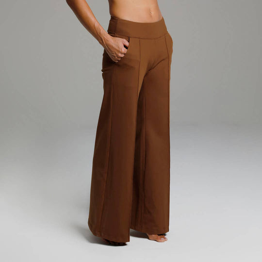 Perfect High Waist Wide Leg Pant (Bronze)
Why We Love This: These yoga dress pants take on the true meaning of activewear, taking you comfortably from the office, to the streets, to the yoga studio! Features: KiraGrace PowerStrong: Feels like cotton and keeps you dry High-rise, 32" Inseam Wide leg Made in U.S.A. of imported fabric Kira Grace PowerStrong: Supplex/Spandex *SUPPLEX® combines the traditional appeal of cotton with the performance benefits of modern fiber technology. Supplex fabrics are breathabl
