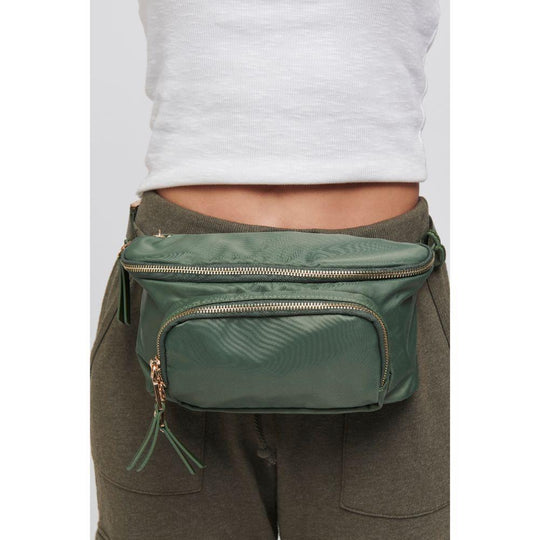 Double Take Belt Bag - Olive
Your life is multi-dimensional. Shouldn’t your accessories be too? With the Double Take belt bag, you’ll be hands free and able to catch every opportunity that comes your way. Item Type: Belt Bag Material: Nylon Closure: Zipper Adjustable Strap Drop: 17" Interior Details: Water repellant nylon lining; 1 zipper compartment; 1 slip pocket Exterior Details: 1 Zipper compartment and 1 Front zip pocket; 1 back slip pocket with snap closure Dimensions: 9.5" L x 3.75" W x 5.5" H
Double
