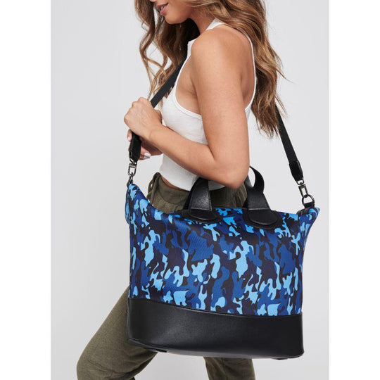 Dream Big Weekender Bag - Navy Camo
Find yourself hitting snooze every morning? While it’s tempting to stay in bed and keep dreaming, turn those dreams into reality with our Dream Big tote This stylish handbag features a handle and a cross body strap. It’s interior pocket will accommodate your tablet and all of your necessities to crush those goals. Because your dreams should always be bigger than your bag. Item Type: Weekender Material: Neoprene Closure: Zipper Handle Drop: 6'' Shoulder Strap: 16''-25'' In