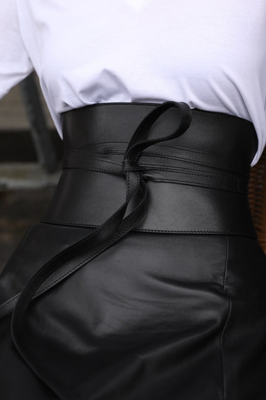Corset Belt - Pitch Black
PRITCH London's first ever created obi corset belt in classic black. This Japanese inspired wrap around tie belt with seam detailing has the label's signature aesthetic. Designed to shape and define your waist, this sculpting leather piece is made of two leather panels that form a feminine yet strong silhouette. The belt is finished off with two long straps that can be tied around in many different ways, so every time you get a newer version of the knot. Instantly update any outfit