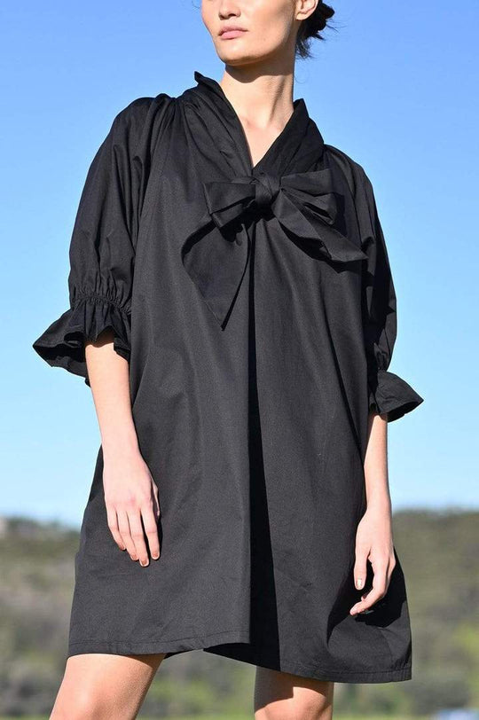 Adrian Reversible Dress - Black
The Adrian is Restocked - don't miss out on this fabulous dress We are excited about the Adrian - an oversized mini dress with on-trend puff sleeves, high neck and nape ties. The Adrian dress can also be worn back to front so you have a v- neckline and use the ties to to create a low knot or a bow at the front. So versatile, and such a statement piece! In the cooler months, team with tights and boots or wear over jeans. Designed for an oversized fit High Neck Nape Ties Side p